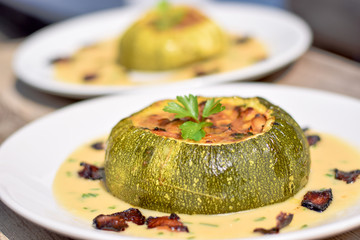 Wall Mural - Tho Baked stuffed Courgettes served on the white wine sauce