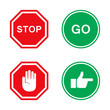 Stop and go signs in red and green with hand