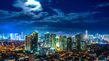 Fototapeta Na drzwi - Rising Moon over the skyline of Metro Manila