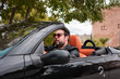 © Cristian Blázquez - Young man driving convertible car. Driver, leisure.