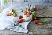 Creamy Sweet Dessert With Fresh Juicy Tasty Strawberries Served Inside A Glass On A Rustic Wooden Table