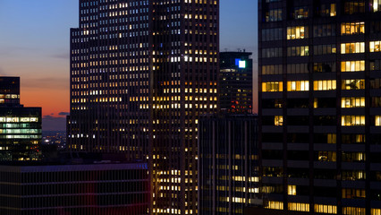 CLOSE UP: Spectacular shot of skyscrapers in New York lighting up at sunset.