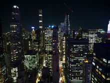 Picturesque View Of The Lit Up Modern Skyscrapers On A Dark Night In New York.