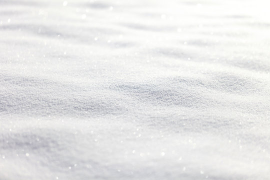 Beautiful sunny bright snow texture winter season copy space background. Selective focus used.