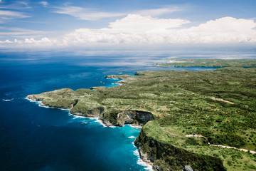 Bird's-eye view. Aerial drone view of cliff near Kelingking beach. Manta Bay or Kelingking Beach on Nusa Penida Island, Bali, Indonesia.