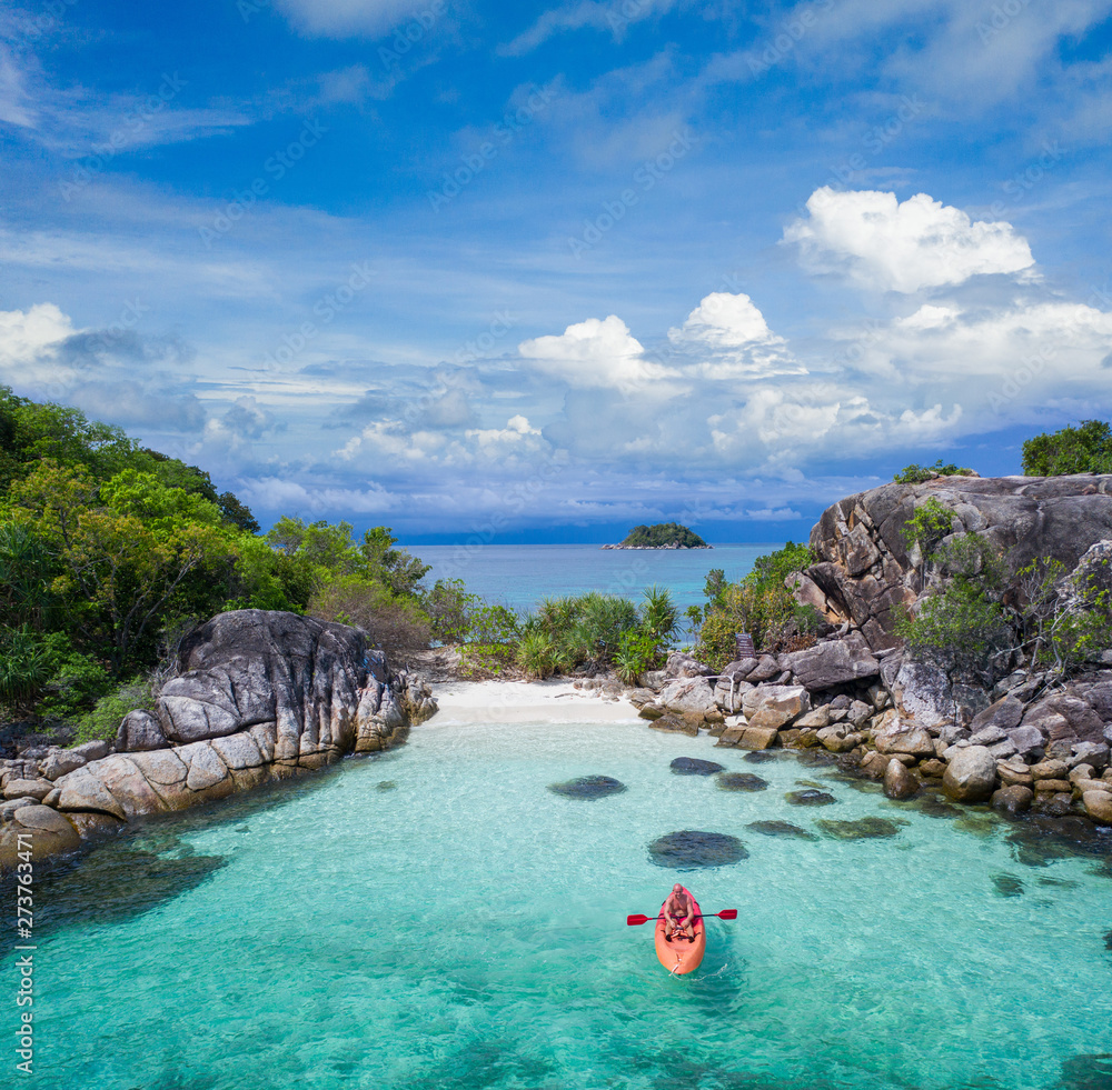 Aerial drone view of in kayak in crystal clear lagoon sea water during summer day near Koh Lipe island in Thailand. Travel tropical island holiday concept - obrazy, fototapety, plakaty 