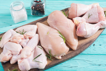 Wall Mural - Raw chicken meat on wooden background