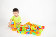 © wckiw - Little boy toddler playing plastic brick block colorful with happy