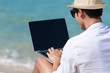 © aFotostock - Busy freelance man with laptop outdoor.  Businessman corporate city life outside with lifestyle technology. Handsome man connect internet outdoor on the beach. Internet technology lifestyle concept.
