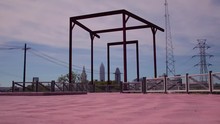 The Towpath Trail In Cuyahoga County, Cleveland, Ohio Along The Erie Canal. A Shot Of The City Skyline From A Part Of The Trail With Steel Framework.