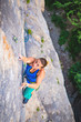 © Александра Голубцова - Woman climbs rock.