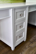 © timltv - Kids desk with drawers. Classic children's furniture in white color close-up