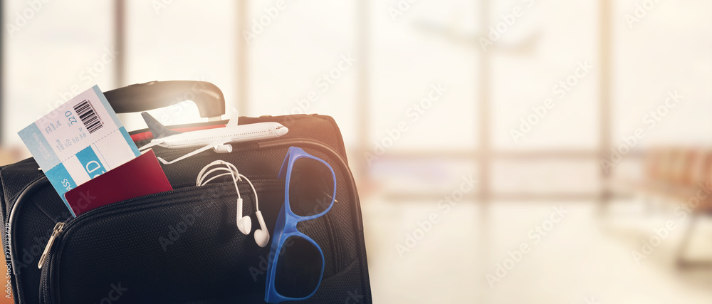 traveling luggage on airport terminal background with copy space - obrazy, fototapety, plakaty 