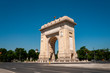 Triumphal Arch, Eastern european landmark and travel destination concept theme with the Arch of Triumph (Arcul de Triumf) in Bucharest (capital city of Romania) against cloudless sky on a summer day