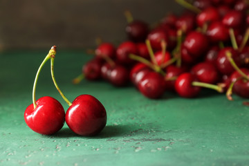 Sweet ripe cherry on color background