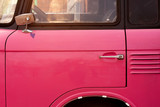 Fototapeta Miasto - Retro pink car close up.