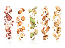 Set Of Various Crushed Nuts In The Air On A White Background