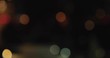 Defocused Night City Lights near Miami Beach. Color Blurred bokeh of people and cars. Pan to left 4K.