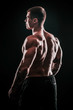 © yurolaitsalbert - rear view.handsome male bodybuilder .isolated on black