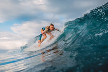 Beautiful Surfer Girl On Surfboard. Woman In Ocean During Surfing. Surfer And Barrel Wave