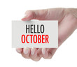 © dolphfyn - Hand showing Hello October.