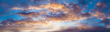 Colorful Image Of Dramatic Cloudscape. Amazing Clouds Of Pink, Purple, Violet, White, Gray Color On The Background Of The Evening Dark Sky After Sunset. Panorama View
