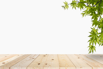 Wall Mural - Green leaves on table wood