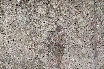 Detailed close up surface of aged and weathered concrete wall textures in high resolution