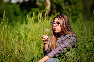 Wall Mural - Young beautiful Asian girl on a walk in the woods in summer