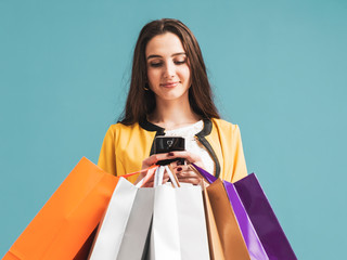 Wall Mural - Happy woman using shopping apps