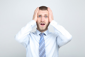 Poster - Surprised young man on grey background