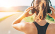 © Soloviova Liudmyla - Close up image of teenager adjusting  wireless headphones before starting jogging and listening to music