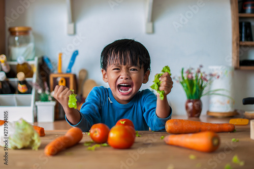 Cuadros en Lienzo The boy who shows an angry emotion, the concept of emotion of a violent child