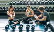 © FotoArtist - group of young poeple sitting on floor after exercised