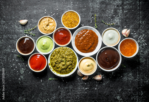 Fotomural Pesto sauce, guacomole, ketchup, mustard, barbecue sauce in bowls