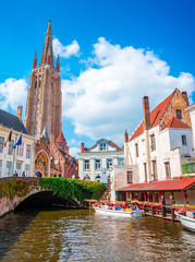 Wall Mural - Church Of Our Lady and traditional narrow streets in Bruges (Brugge), Belgium