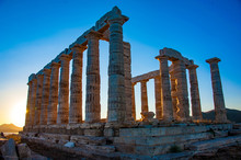 Ancient Greek Temple Of Poseidon / Neptune, At Cape Sounion Near Athens, During Sunset