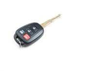 A Toyota Car Key Is Isolated On A White Background.