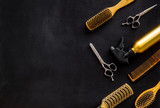 Combs and hairdresser tools in beauty salon work desk on black background top view mockup