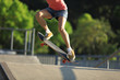 © lzf - Skateboarder skateboarding on skate park