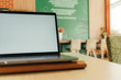 © Sevendeman - Laptop in the coffee cafe with white empty display.