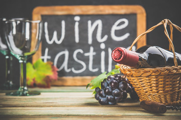 Wall Mural - Wine composition on dark rustic background, space for text