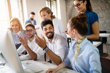 Group of young businesspeople or designers work with new startup project in office