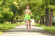 © Pixel-Shot - Sporty young woman running in park