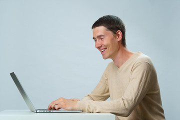 Man is using laptop for communication in chat or video chat. Social media concept.