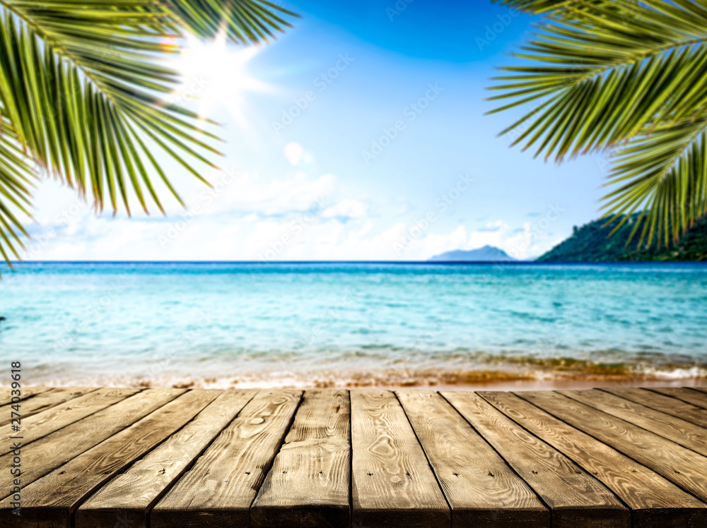 desk of free space and summer beach landscape  - obrazy, fototapety, plakaty 