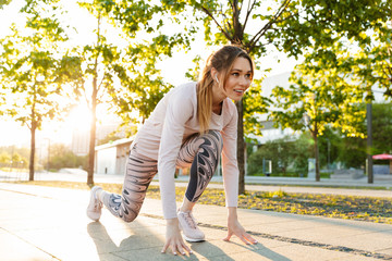 Sticker - Attractive young fitness woman wearing sports clothing