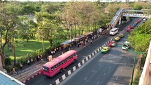 People Waiting For Bus At A Bus Station In Bangkok In The Morning.