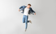 © Pixel-Shot - Jumping young man on light background