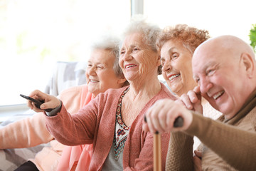 Wall Mural - Group of senior people spending time together in nursing home